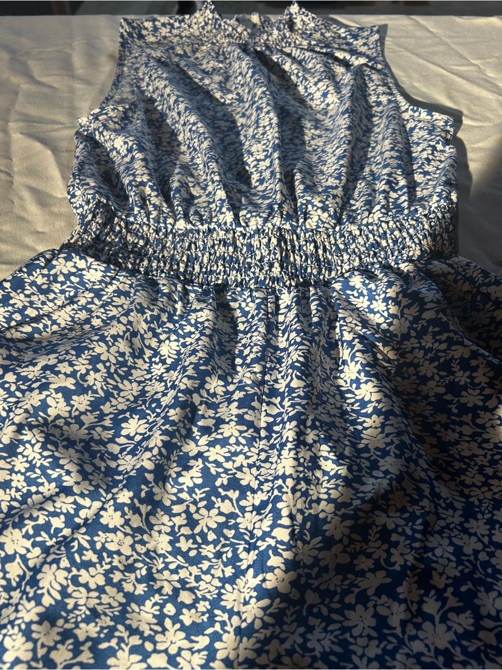 Jump suit.  Blue floral flare leg. With pockets